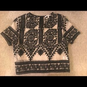 Cropped, embroidered short sleeve top.